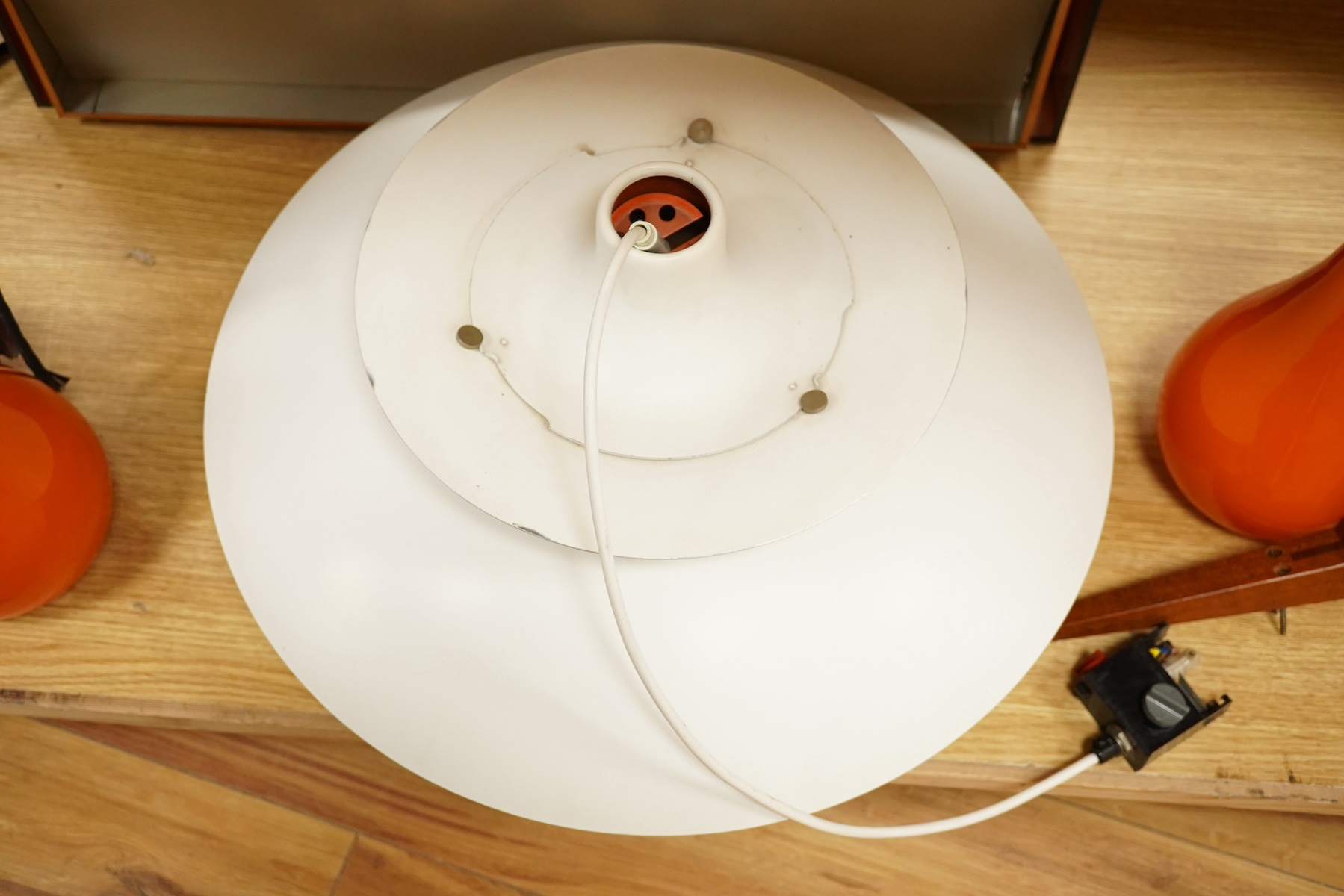 A 1970’s Poul Henningsen PH5 Danish tiered cream and blue enamelled pendant ceiling light and a large rectangular shaped sheet metal ceiling light, together with a pair of Holmegaard teak and orange glass pendant wall li
